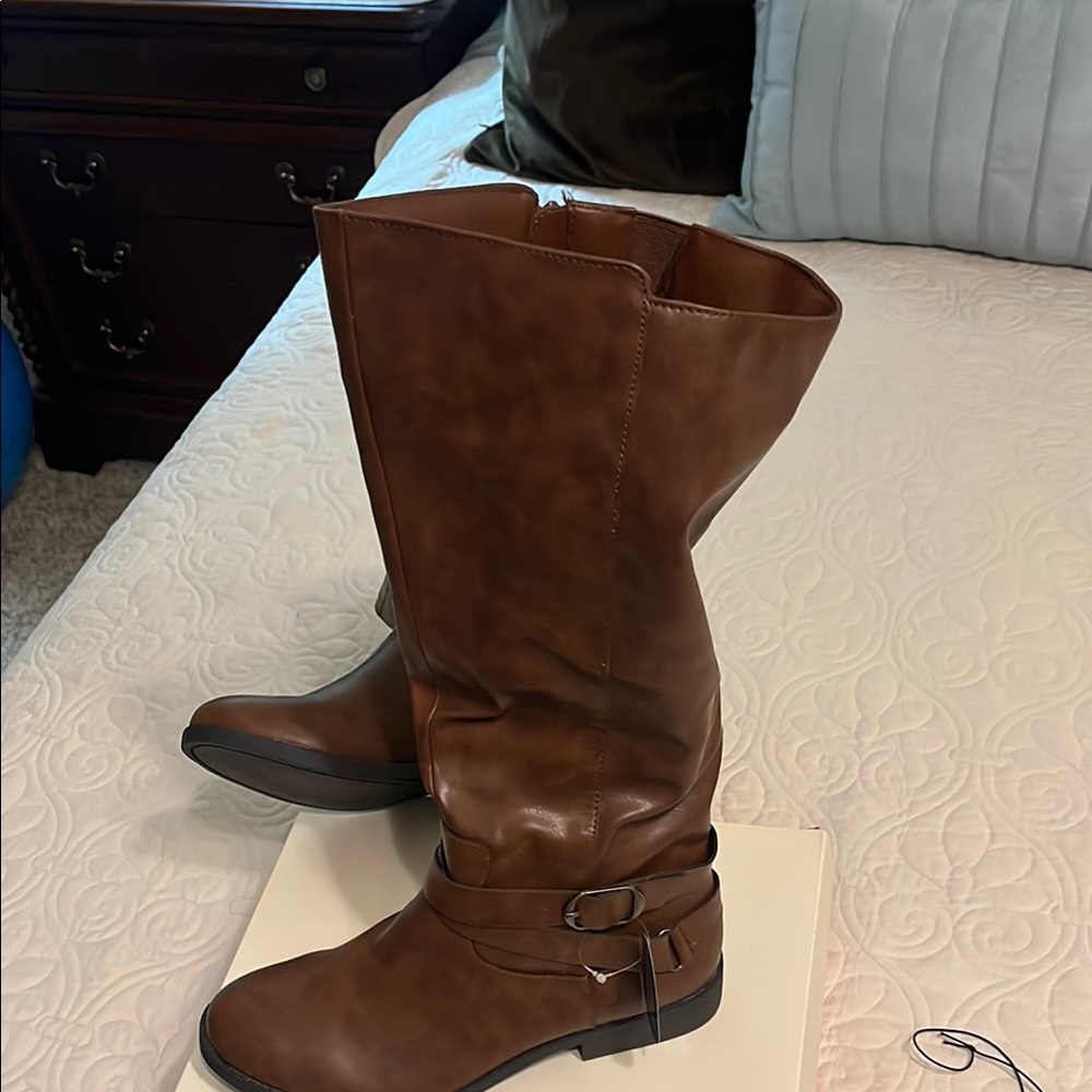 Brown Heeled Boots with Rounded Toe and Decorative Strap